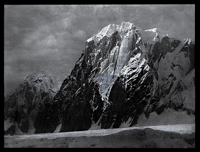 a group of people standing next to a waterfall