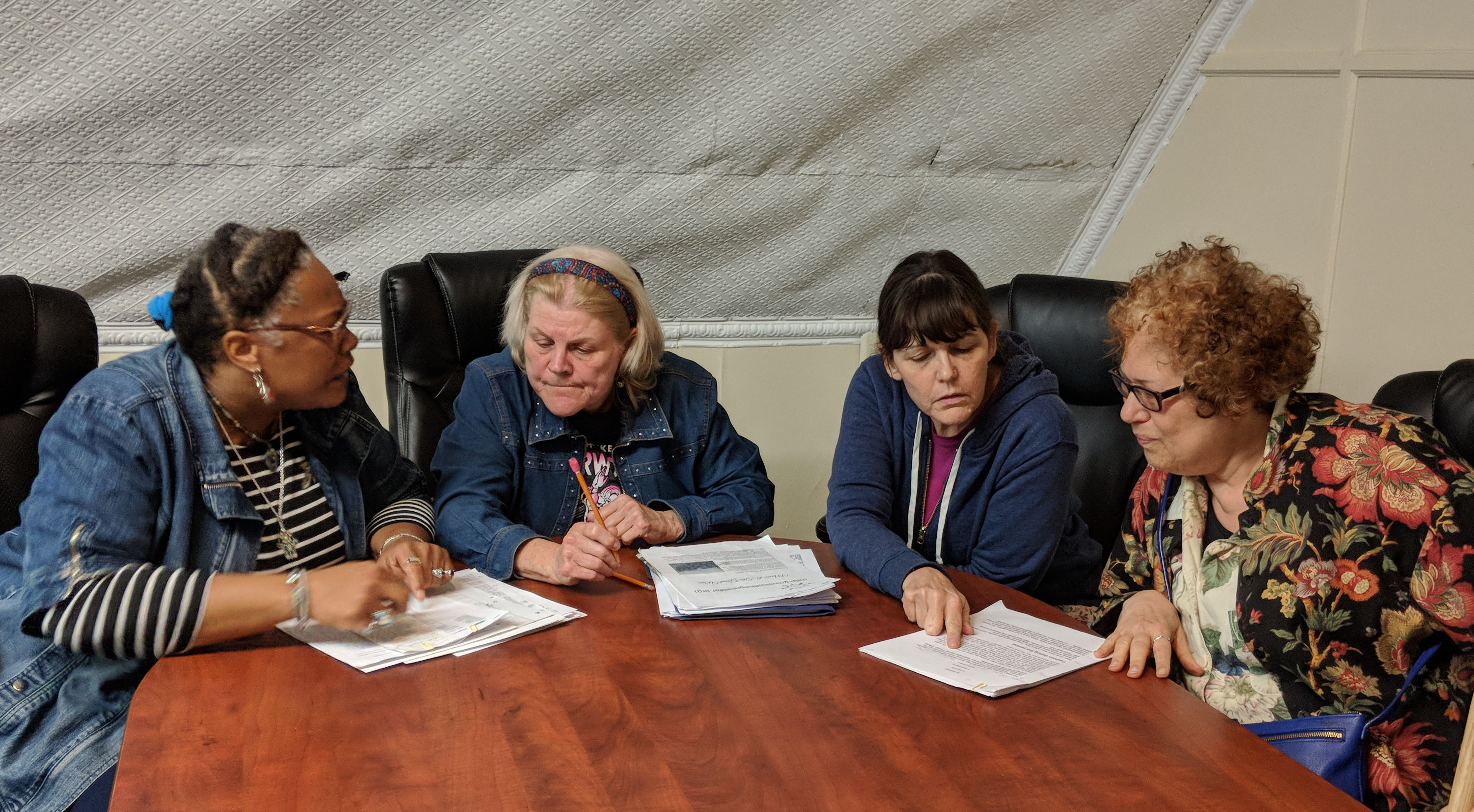 Cookie House, Sally Gladden, Ellen Pavloff and Fran Schiff of The Catskill Readers' Theatre prepare for "WORLD WAR I," an original program featuring local soldiers' letters, music and literature. Missing from the picture are Albee Bockman, Paul Preurscvhner and Bunny Woloszyak.