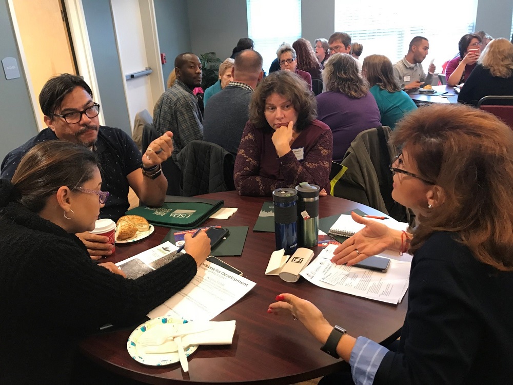 a group of people sitting at a table
