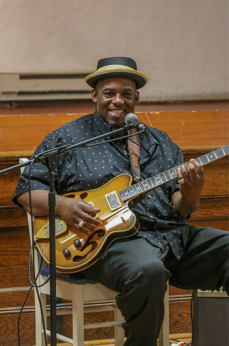 a man holding a guitar