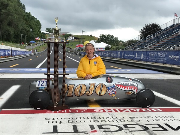a person sitting on a race track