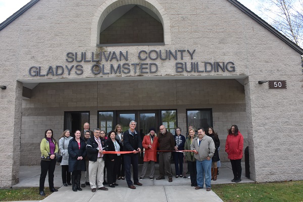 a group of people standing in front of a building